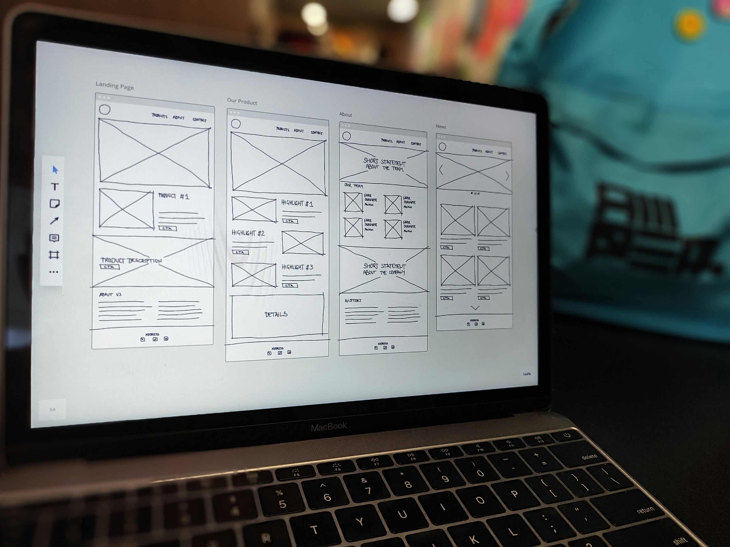 laptop showcasing sketches of user interface design